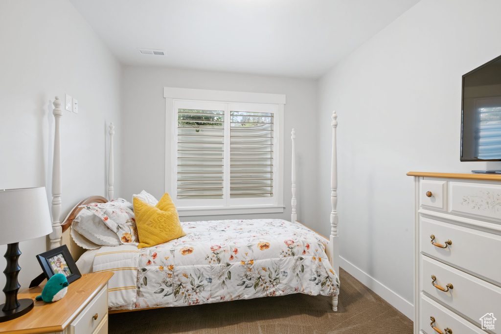 Bedroom with carpet and baseboards