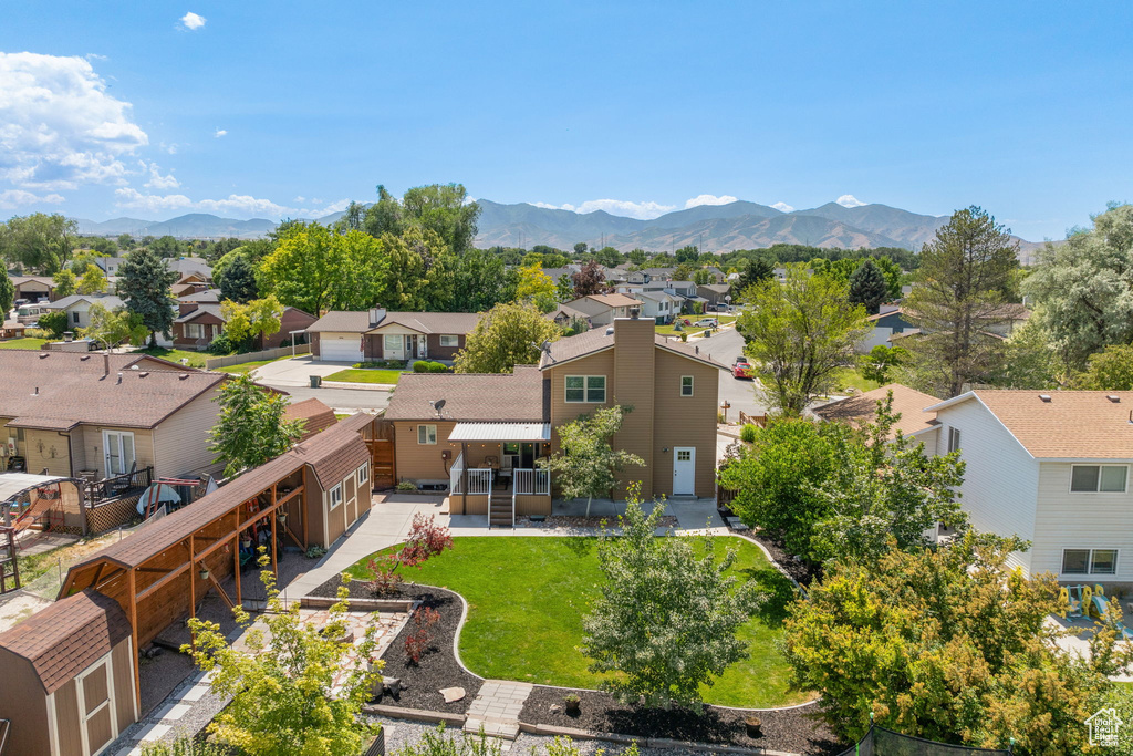 Aerial perspective of suburban area featuring a mountainous background