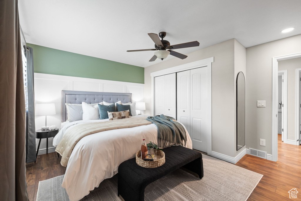 Bedroom featuring a closet, wood finished floors, ceiling fan, and recessed lighting