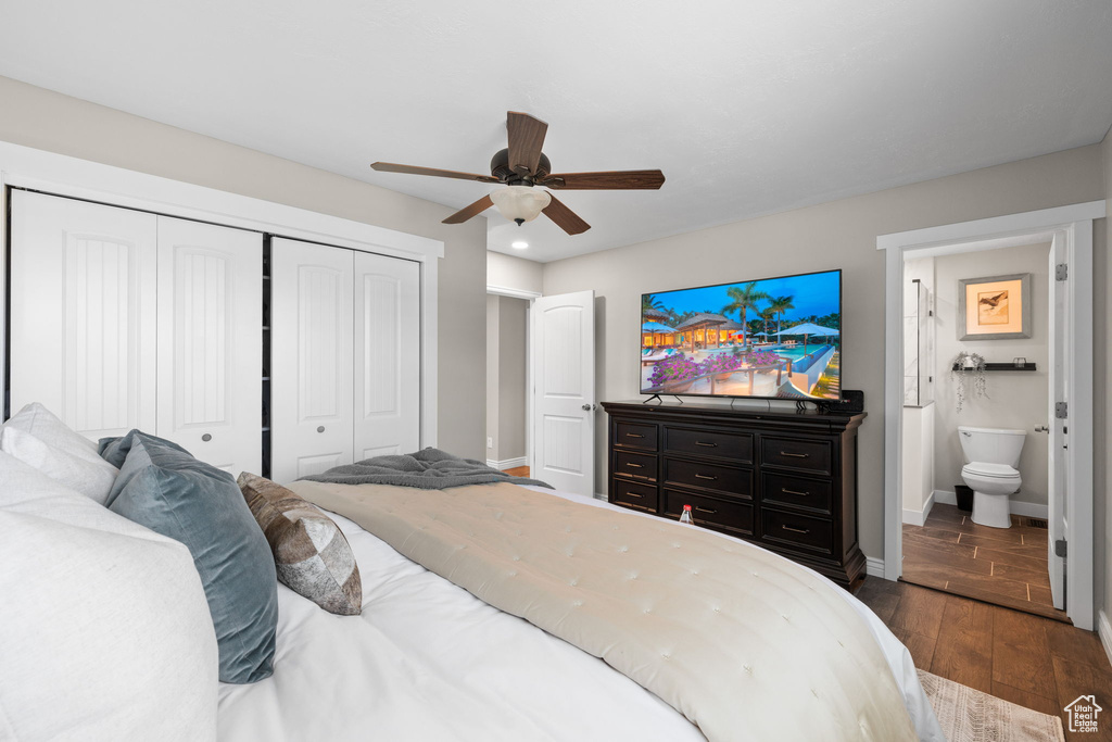 Bedroom featuring dark wood-style flooring, a closet, recessed lighting, ceiling fan, and connected bathroom