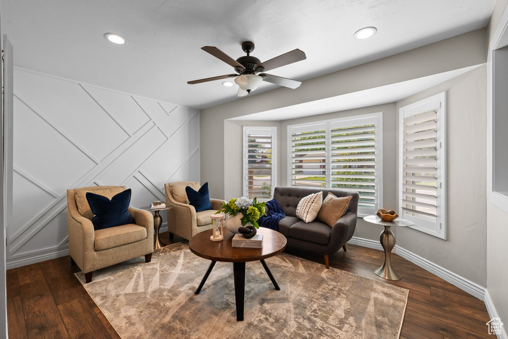 Living room with ceiling fan, wood finished floors, and recessed lighting