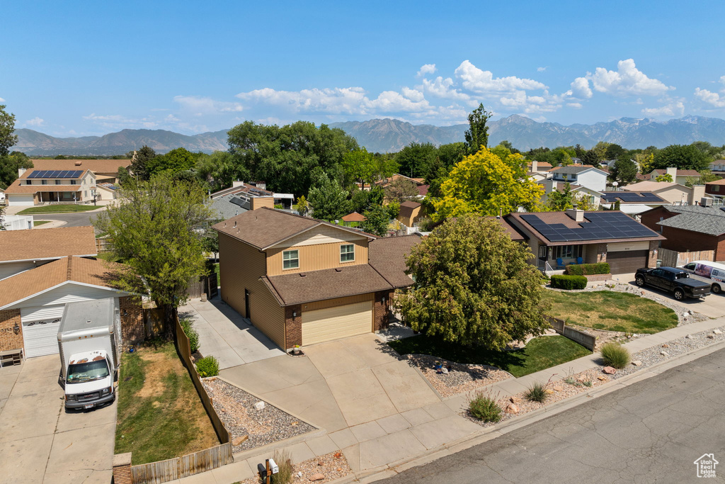Aerial perspective of suburban area with a mountainous background