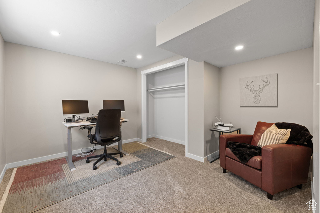 Office space with carpet flooring and recessed lighting