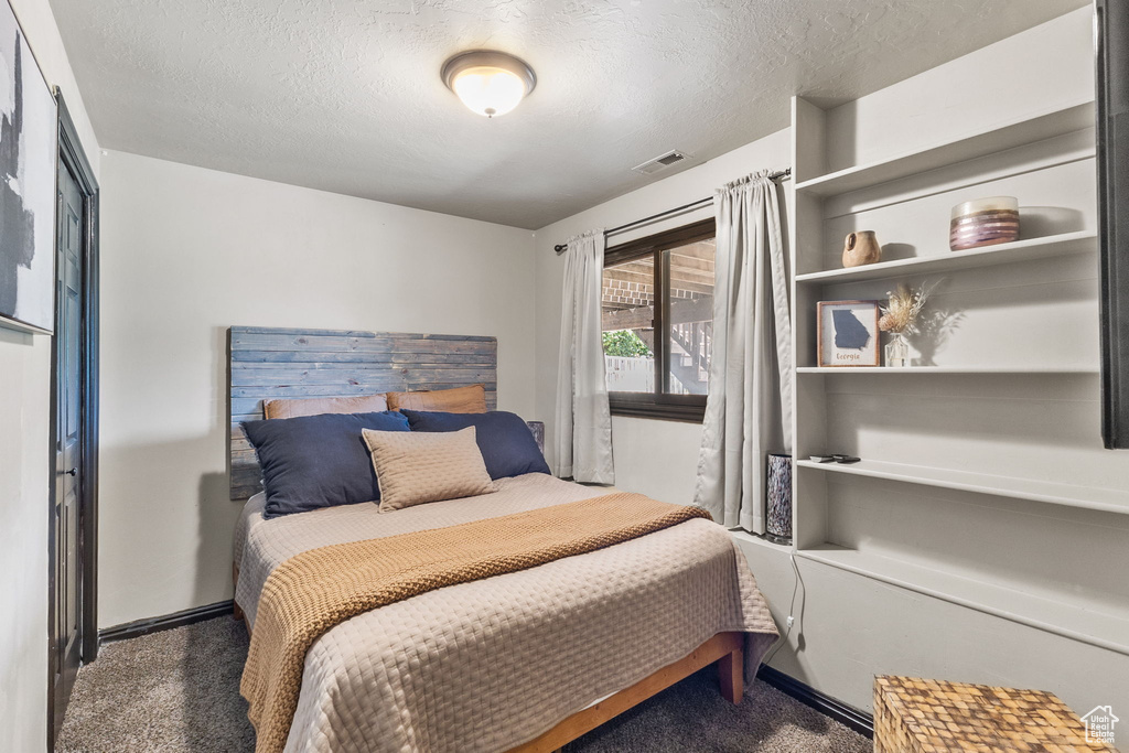 Bedroom featuring a textured ceiling