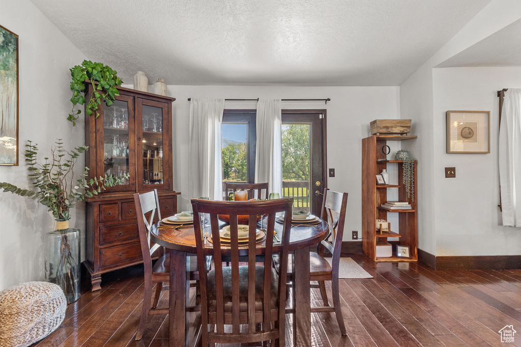 Dining room with dark wood finished floors
