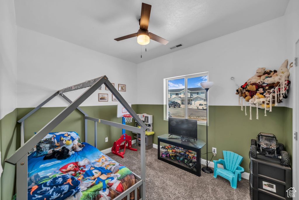 Bedroom featuring carpet floors and a ceiling fan