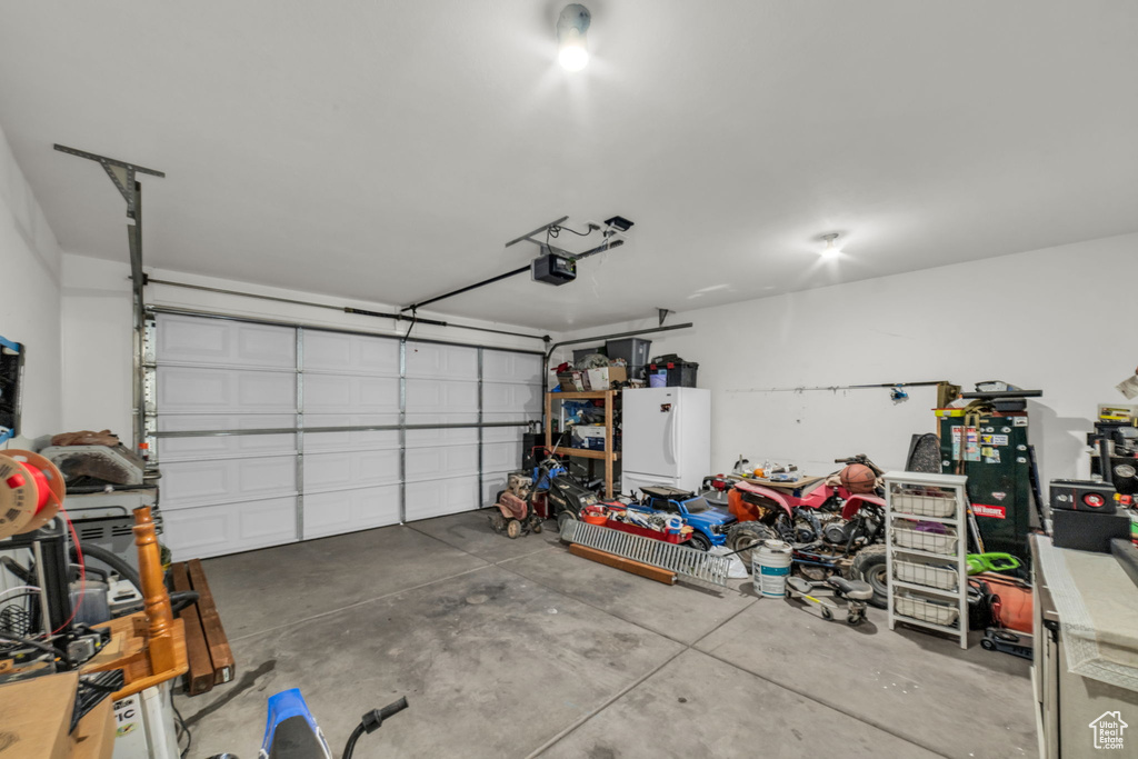Garage featuring a garage door opener