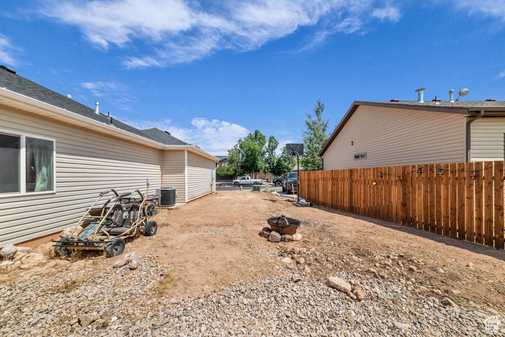 View of yard featuring an outdoor fire pit