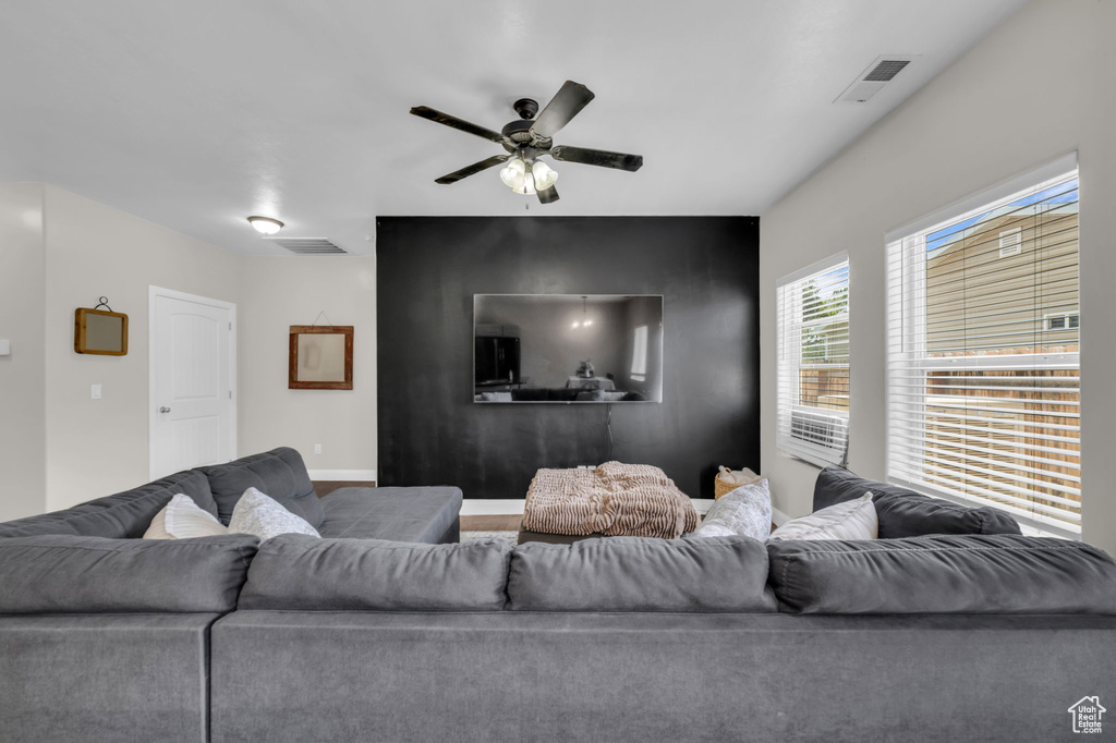 Living area featuring ceiling fan