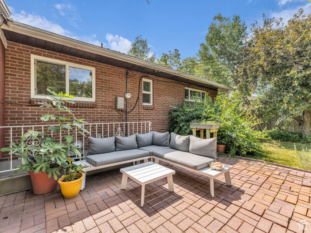 View of patio featuring an outdoor hangout area