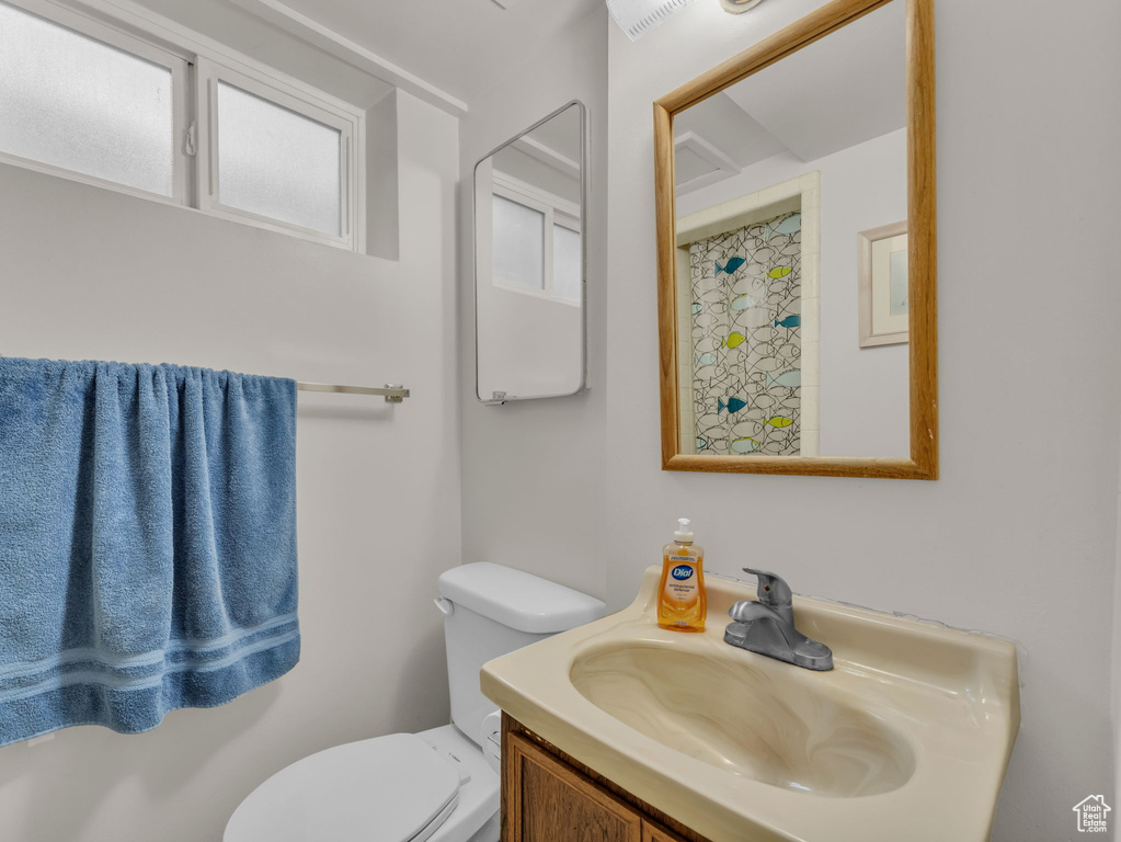Bathroom with toilet and vanity
