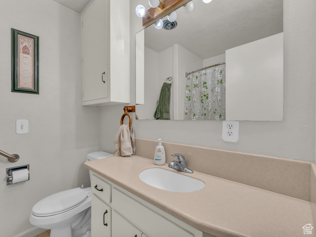 Bathroom with vanity and a shower with shower curtain