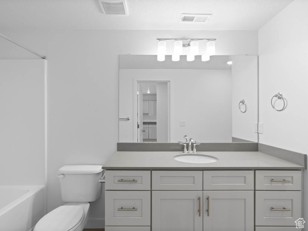 Bathroom featuring vanity and bathtub / shower combination