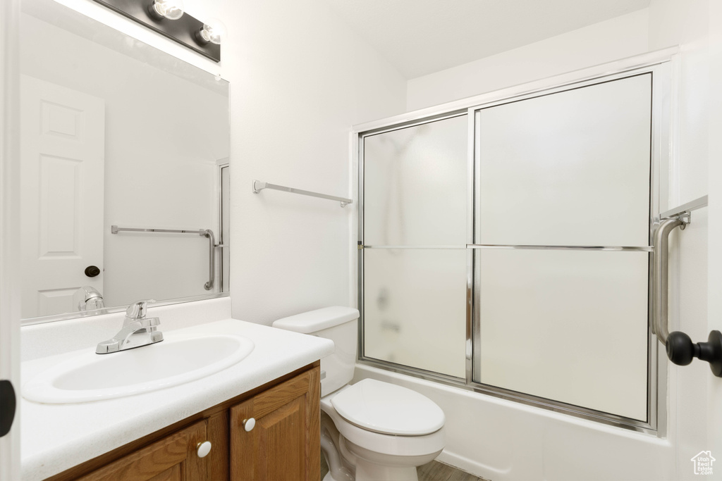 Full bathroom with vanity and shower / bath combination with glass door
