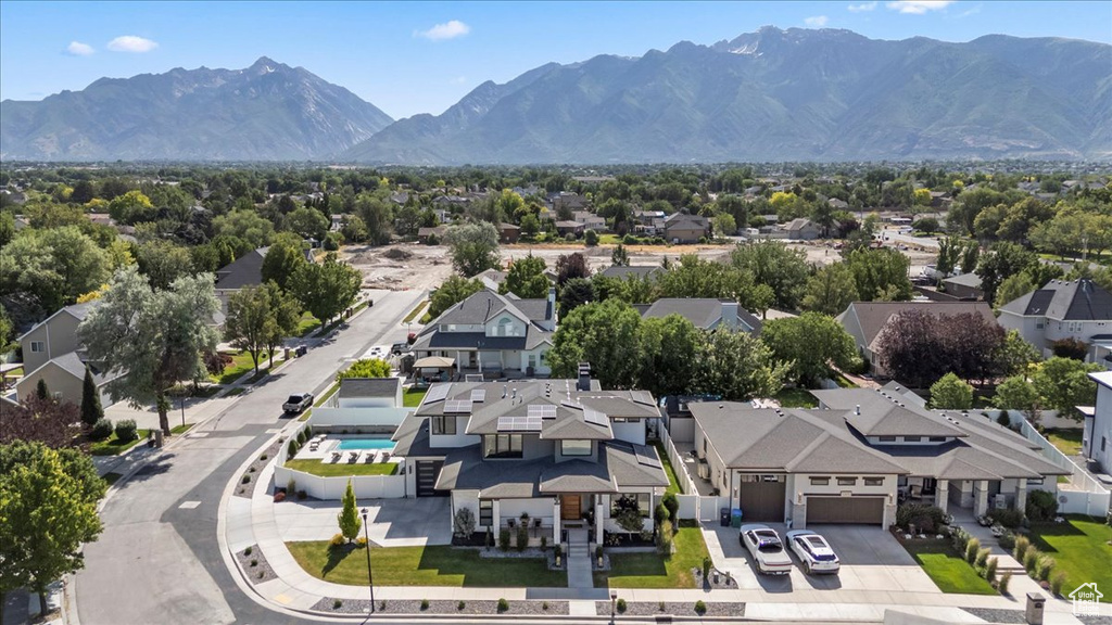 Aerial perspective of suburban area featuring a mountainous background