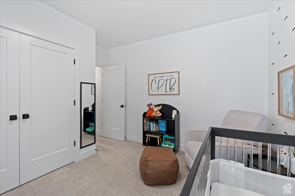 Bedroom with carpet floors and a closet