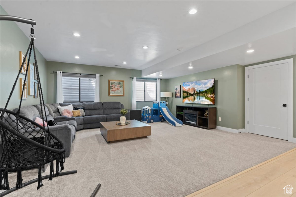 Living area with recessed lighting and wood finished floors