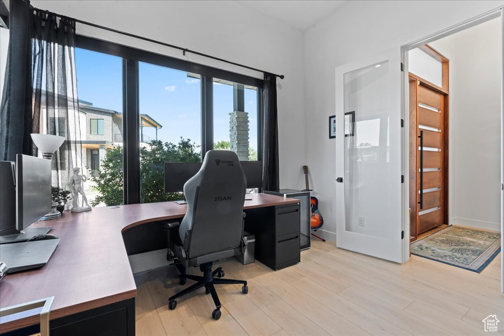 Office space with light wood-style floors