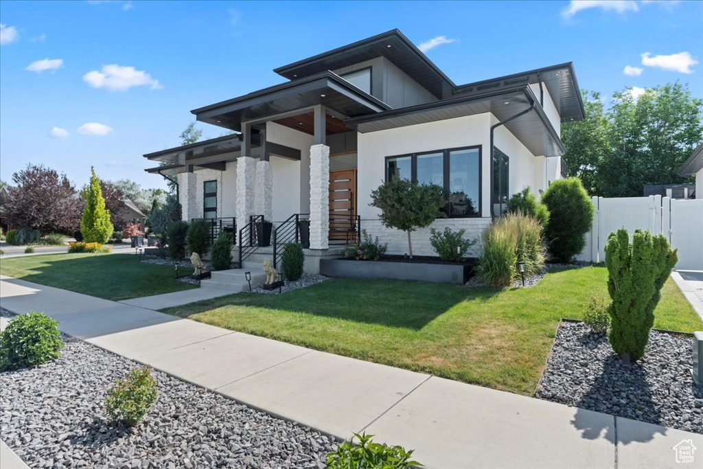 Modern home featuring stucco siding