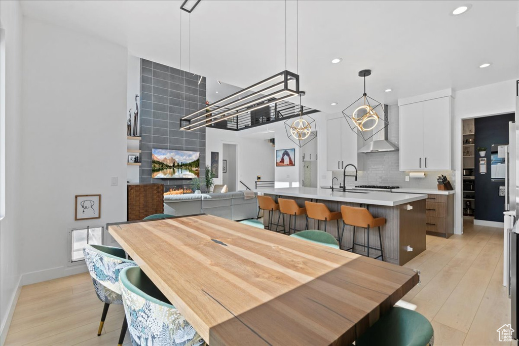Dining area featuring light wood-style flooring and recessed lighting