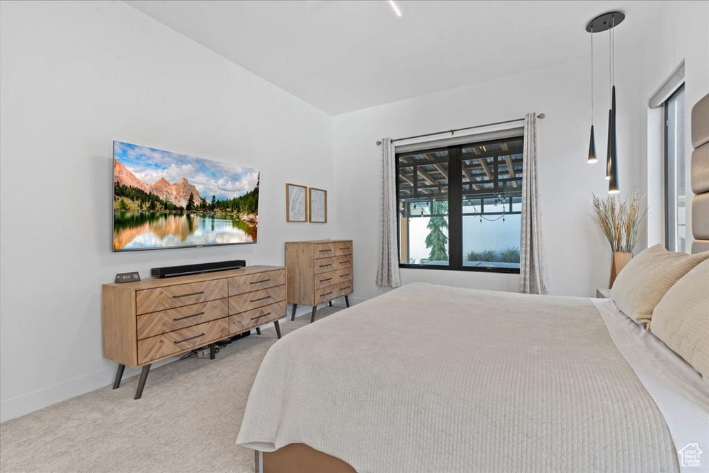 Bedroom with carpet flooring and baseboards