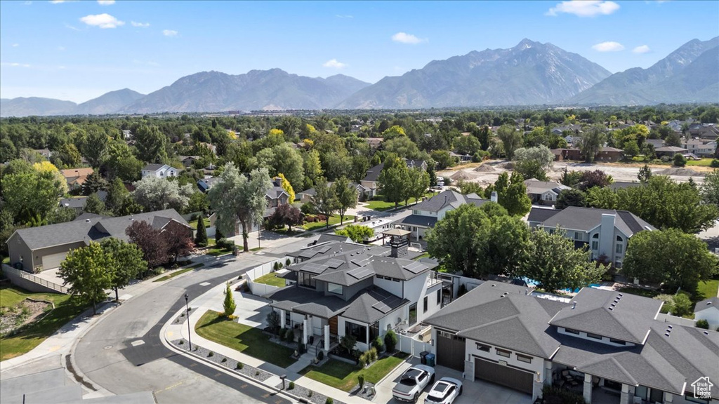 Aerial view of residential area featuring mountains