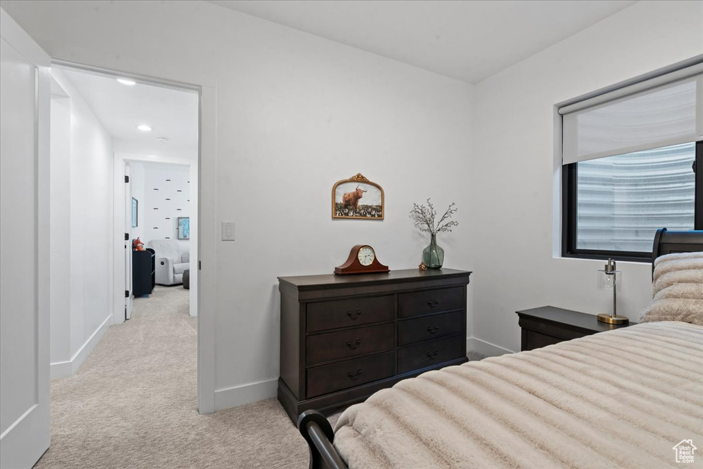 Carpeted bedroom featuring baseboards and recessed lighting