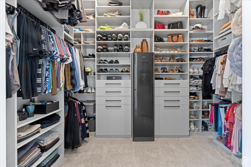 Walk in closet featuring carpet