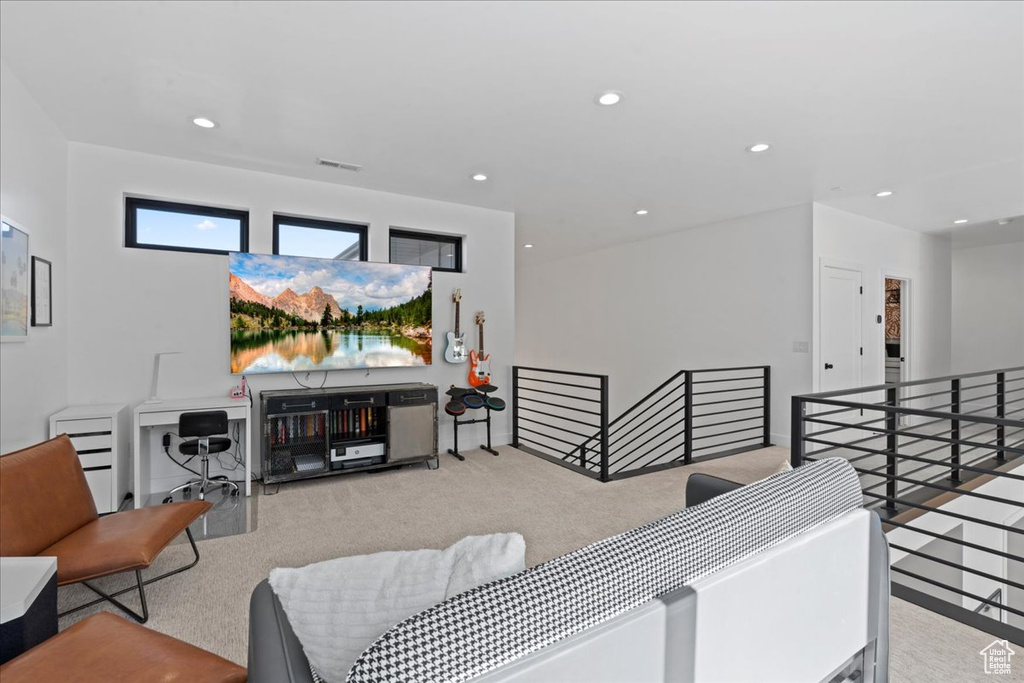 Living room featuring carpet flooring and recessed lighting