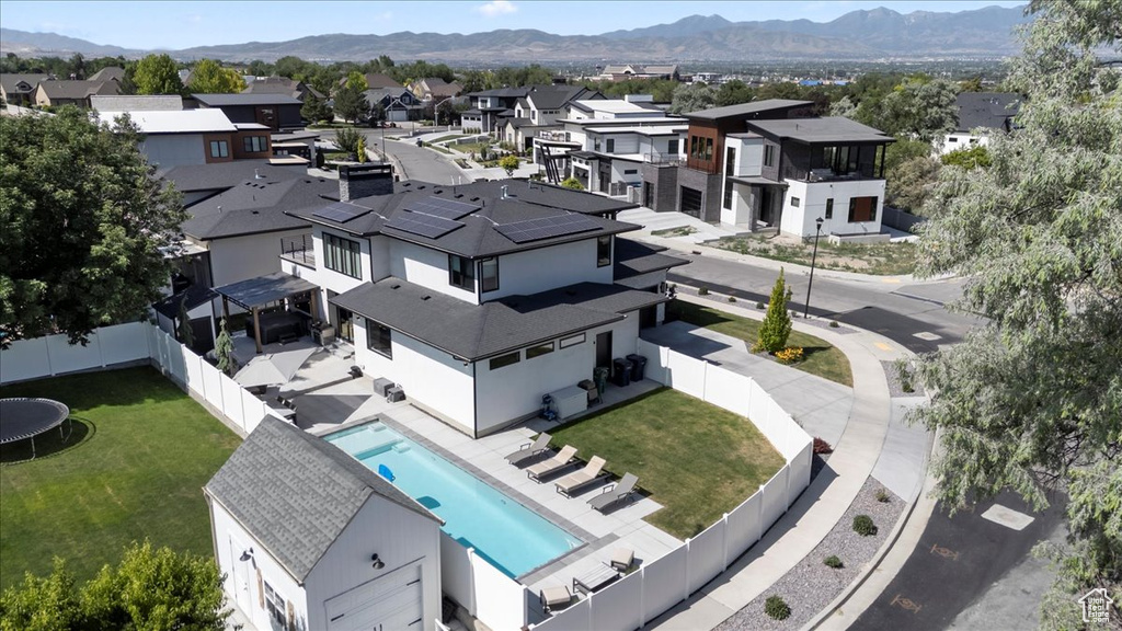 Aerial perspective of suburban area with a mountainous background
