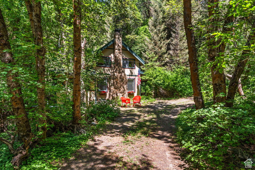 View of yard featuring a wooded view