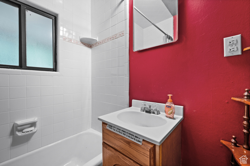 Full bathroom featuring vanity and shower / bathtub combination