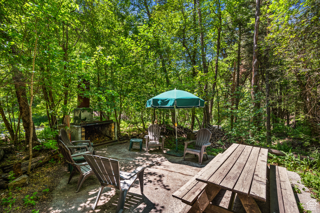 View of patio with a view of trees