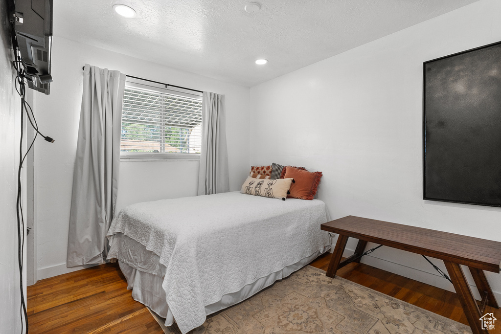 Bedroom featuring wood finished floors and recessed lighting