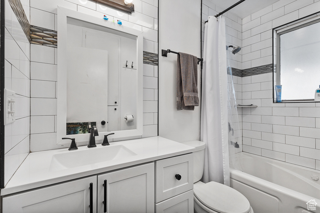 Full bathroom featuring vanity and shower / tub combo
