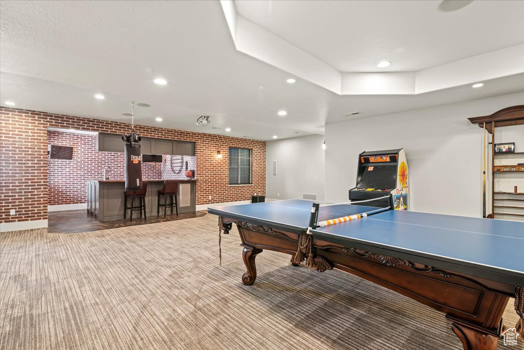 Game room with brick wall, a community bar, recessed lighting, carpet floors, and billiards table