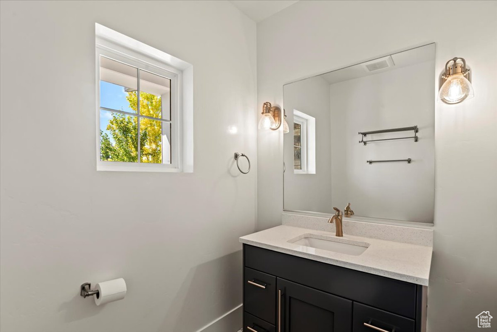 Bathroom with vanity and baseboards