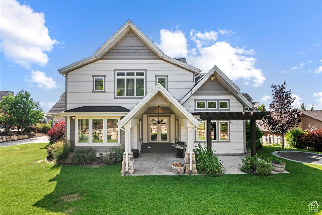 Rear view of house featuring french doors and a patio