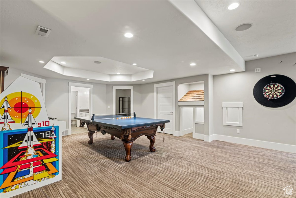 Rec room featuring a tray ceiling, recessed lighting, light colored carpet, and pool table