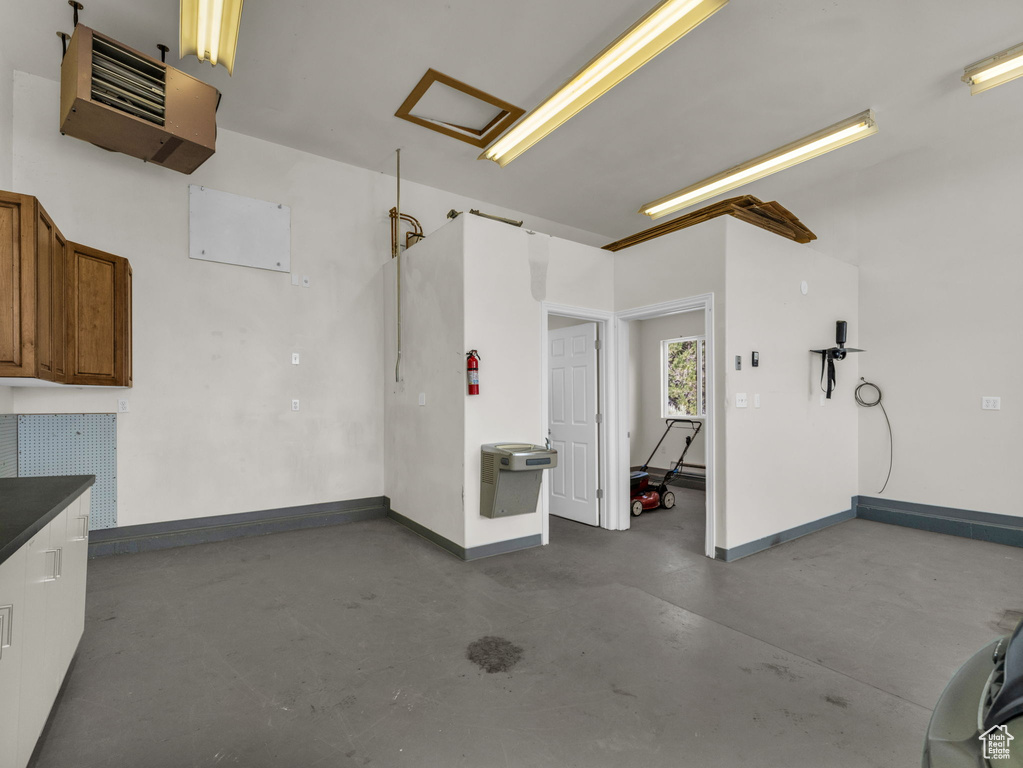 Garage with a heating unit and baseboards