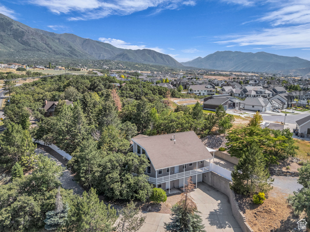 Aerial perspective of suburban area featuring a mountainous background