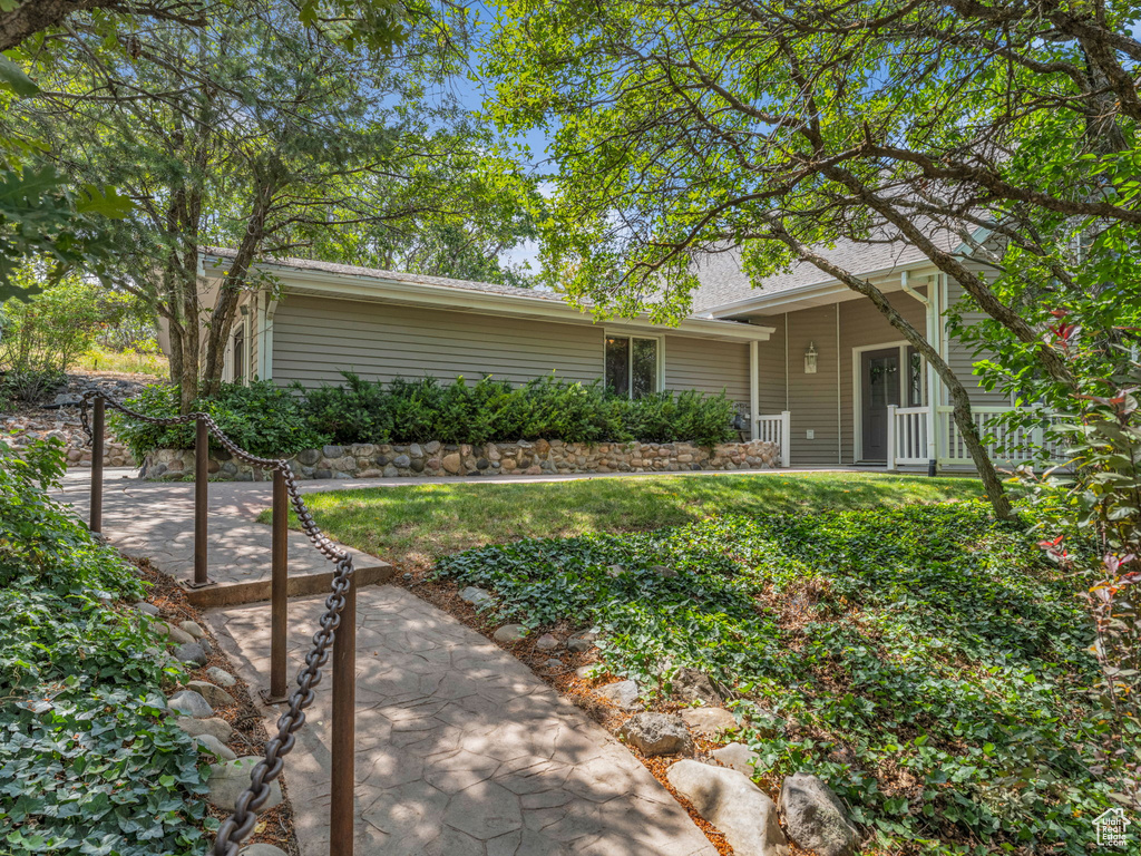 Rear view of property featuring a yard