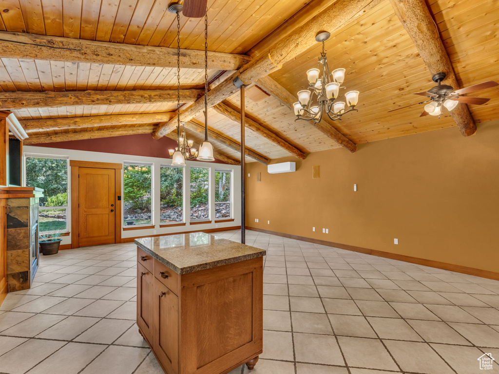 Kitchen featuring a chandelier, wood ceiling, light tile patterned floors, and healthy amount of natural light