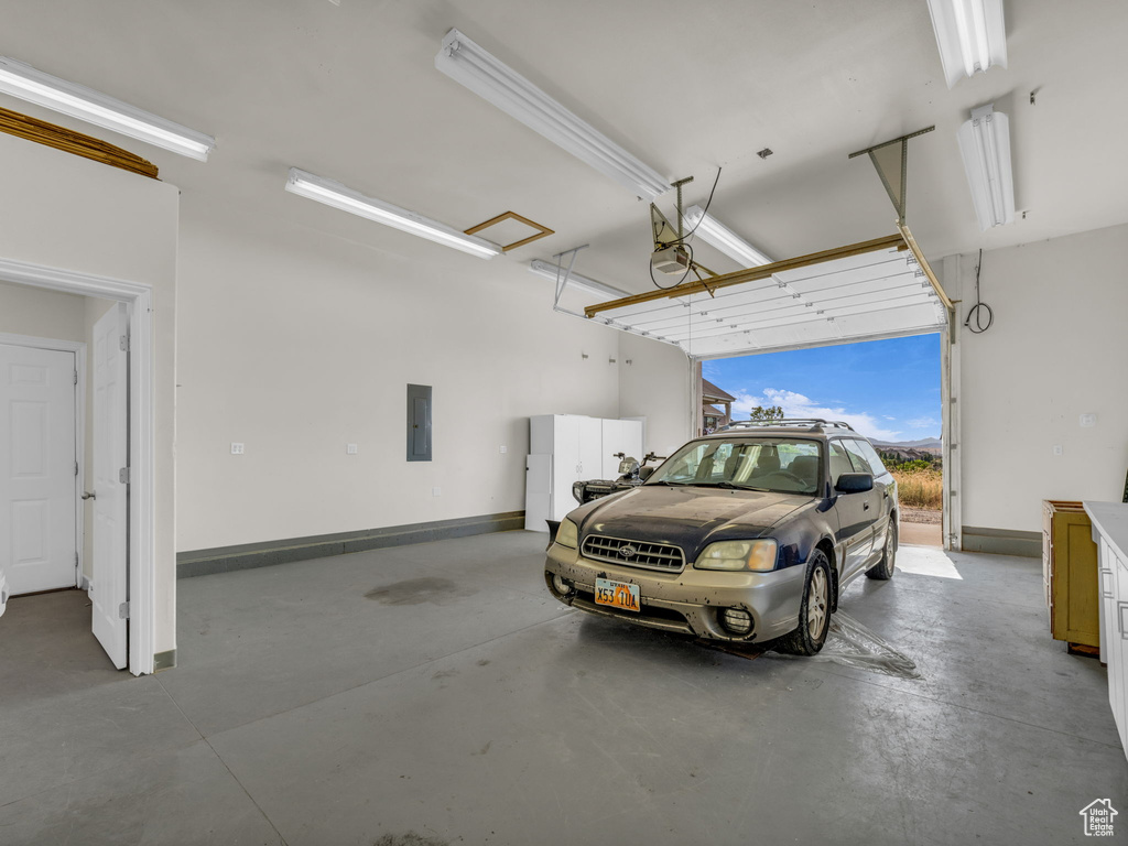 Garage with a garage door opener and electric panel
