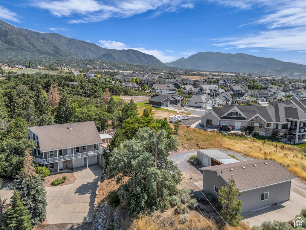 Aerial perspective of suburban area featuring a mountain backdrop