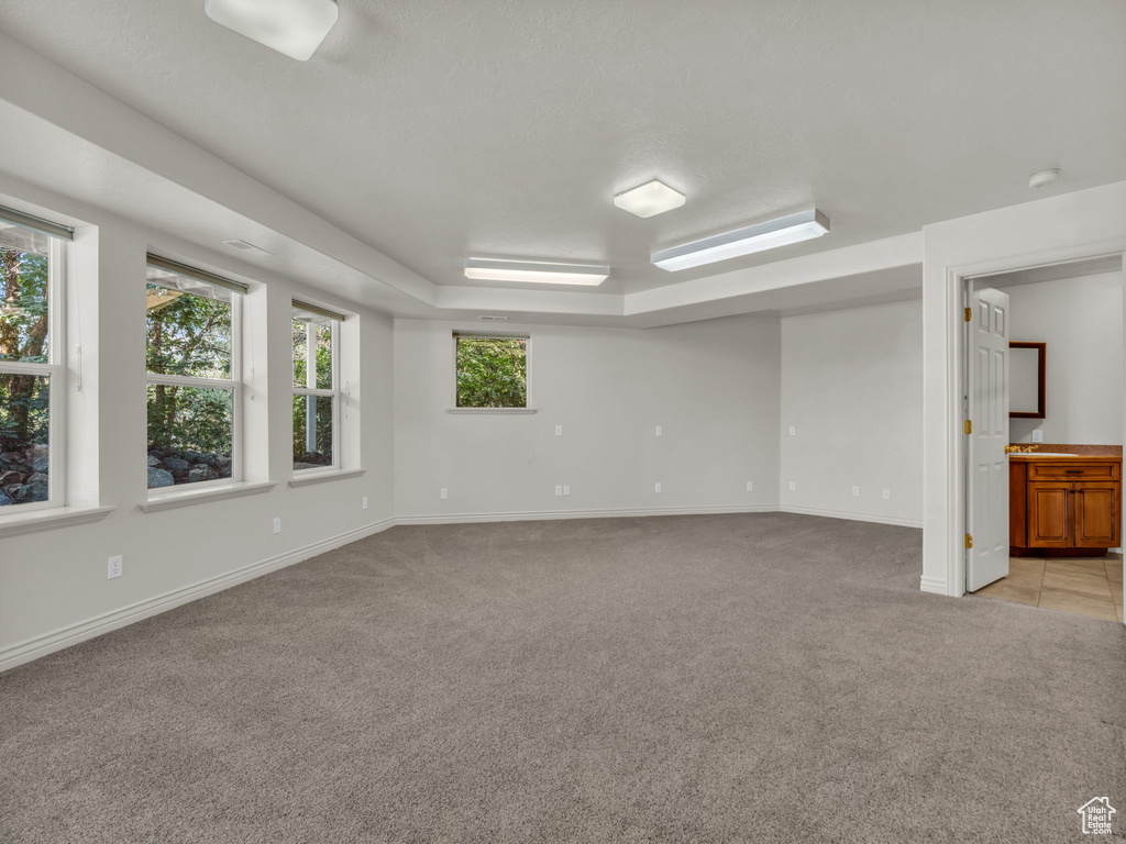 Spare room featuring light colored carpet