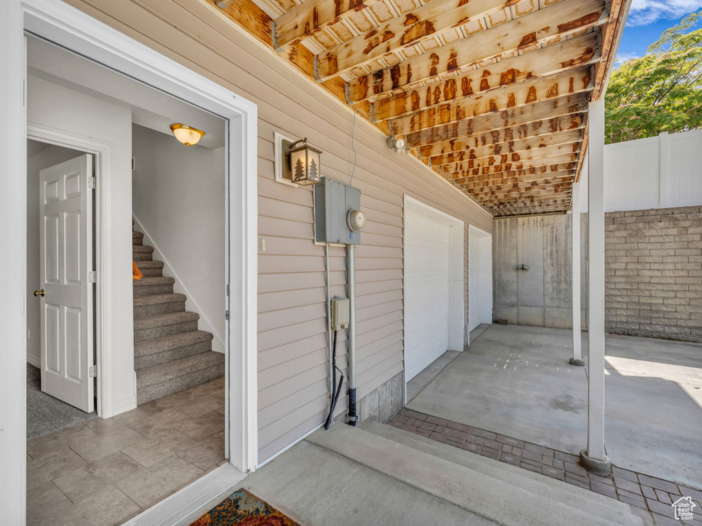 View of patio featuring a garage