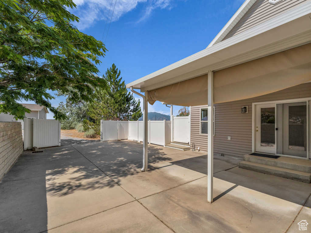 View of patio / terrace with entry steps and concrete driveway