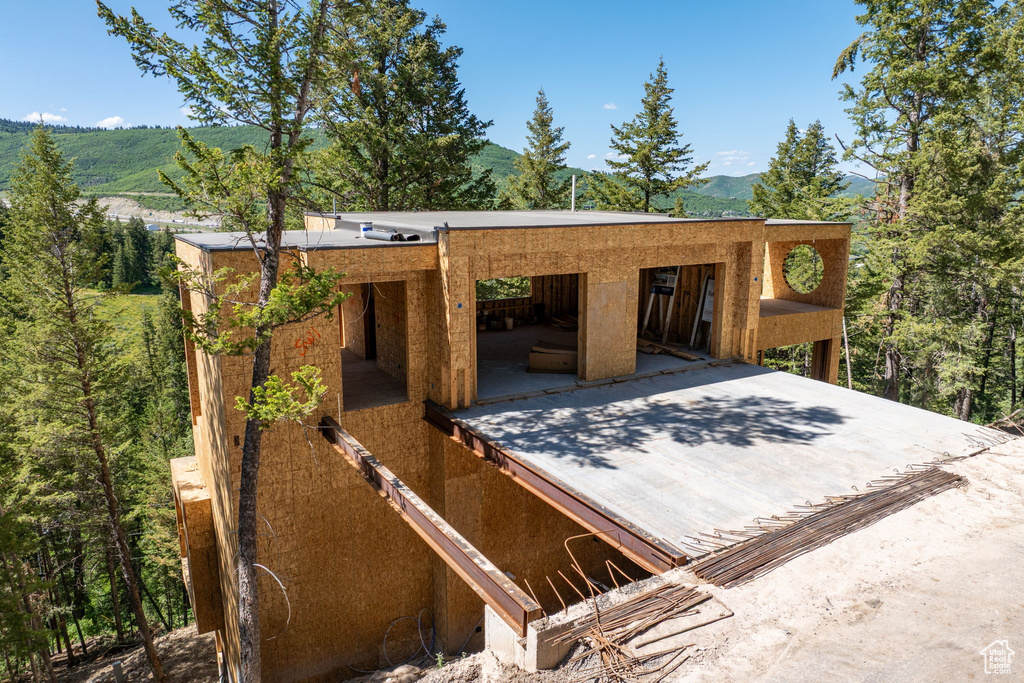 View of side of property with a mountain view