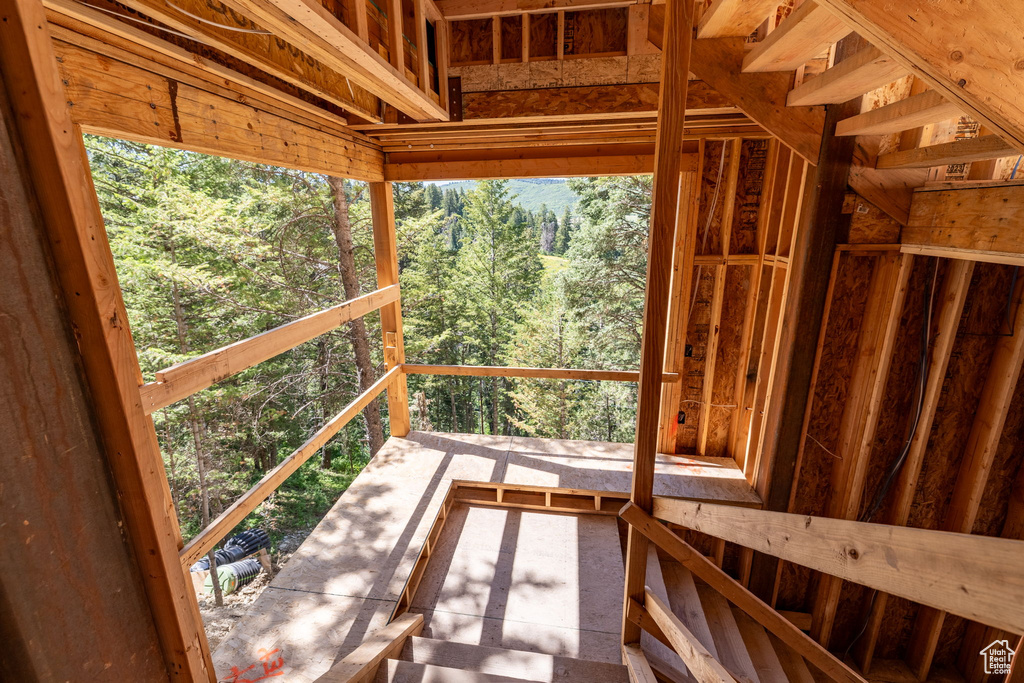 Wooden deck featuring a forest view